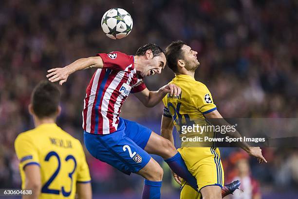 Diego Roberto Godin Leal of Atletico de Madrid fights for the ball with Aleksandr Gatskan of FC Rostov during their 2016-17 UEFA Champions League...