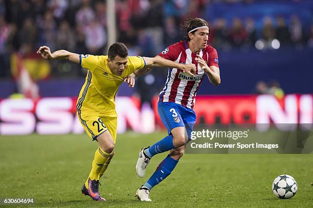Filipe Luis of Atletico de Madrid battles for the ball with Andrei Prepelita of FC Rostov during their 2016-17 UEFA Champions League match between...