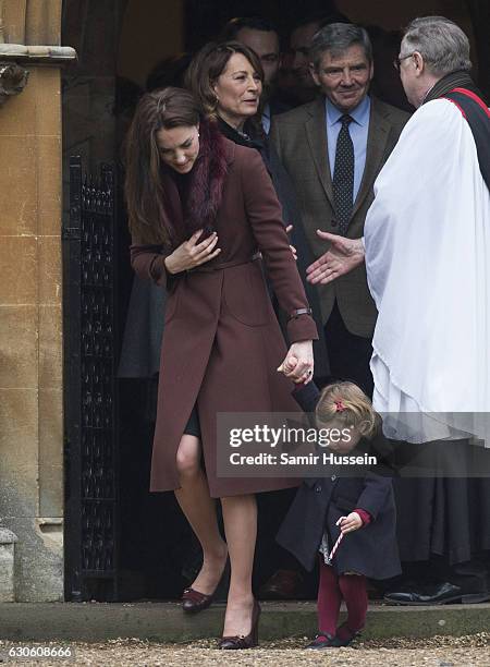 Catherine, Duchess of Cambridge and Princess Charlotte of Cambridge attend Church on Christmas Day on December 25, 2016 in Bucklebury, Berkshire.