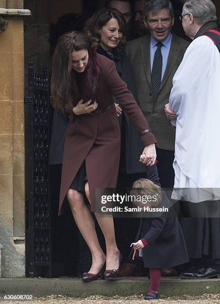 Catherine, Duchess of Cambridge and Princess Charlotte of Cambridge attend Church on Christmas Day on December 25, 2016 in Bucklebury, Berkshire.