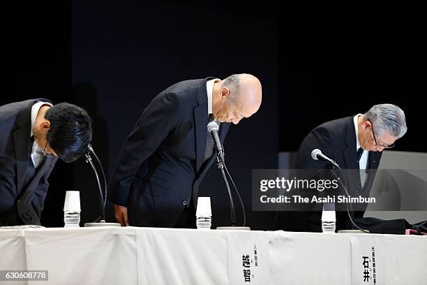 Dentsu Inc. President Tadashi Ishii bows during a press conference at the company headquarters on December 28, 2016 in Tokyo, Japan. Labour...