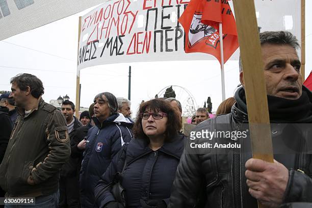 Members of the POE-OTA trade union shout slogans and hold banners during a protest against disemployment in Athens, Greece on December 28, 2016.