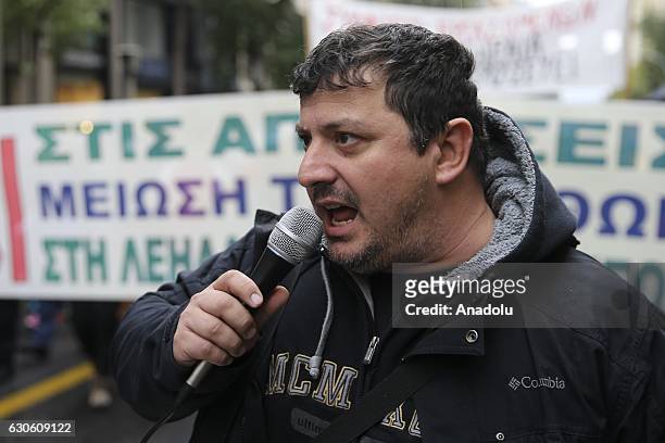 Members of the POE-OTA trade union shout slogans during a protest against disemployment in Athens, Greece on December 28, 2016.