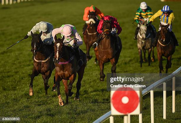 Dublin , Ireland - 28 December 2016; Vroum Vroum Mag, with Ruby Walsh up, races ahead of Clondaw Warrior, with Katie Walsh up, and the field on their...