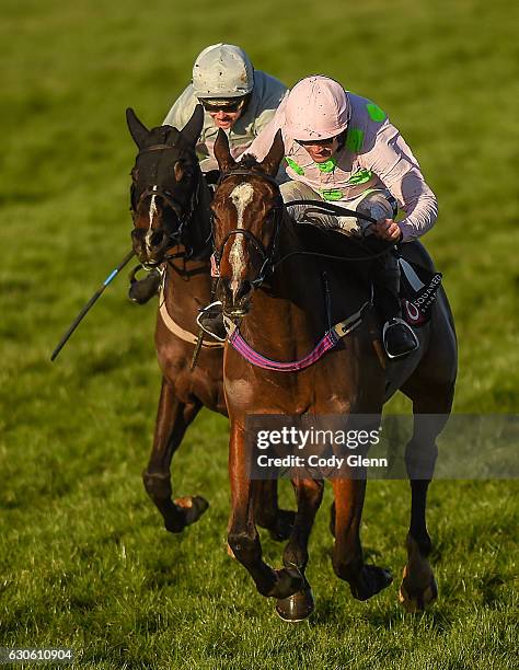 Dublin , Ireland - 28 December 2016; Vroum Vroum Mag, with Ruby Walsh up, races ahead of Clondaw Warrior, with Katie Walsh up, on their way to...