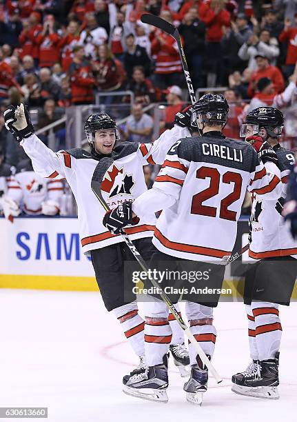 Blake Speers of Team Canada congratulates teammate Anthony Cirelli on his goal against Team Slovakia during a preliminary game in the 2017 IIHF World...