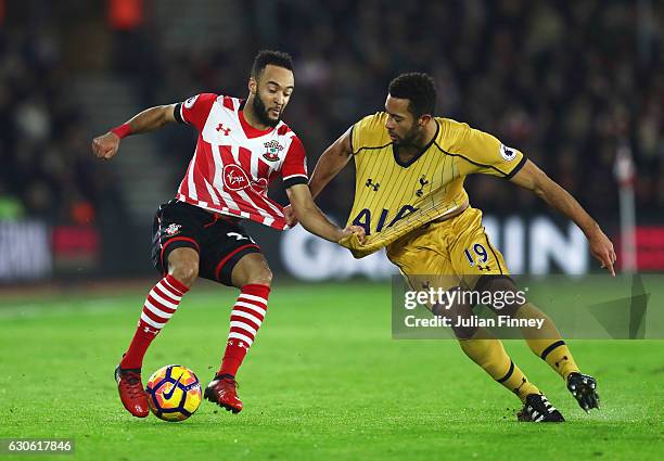 Nathan Redmond of Southampton tangles with Mousa Dembele of Tottenham Hotspur during the Premier League match between Southampton and Tottenham...