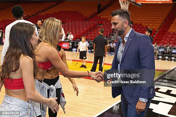 Leonardo Montero, an Argentine TV host, poses for a photo with the Miami Heat dance team before the game against the Oklahoma City Thunder on...