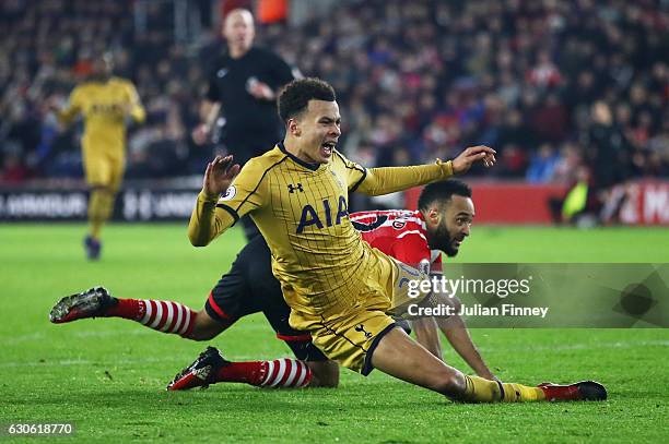 Nathan Redmond of Southampton fouls Dele Alli of Tottenham Hotspur to concede a penalty and is sent off during the Premier League match between...