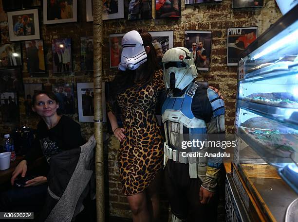 People, dressed with Star Wars movie character costumes pose as Turkish oriented pizza restaurant-chain owner and a three-time World Pizza Spinning...