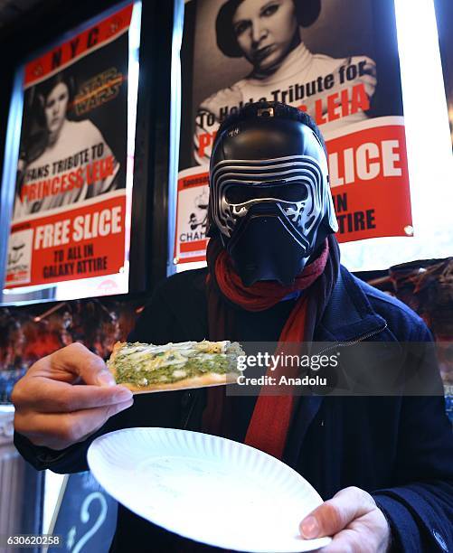 People, dressed with Star Wars movie character costumes pose as Turkish oriented pizza restaurant-chain owner and a three-time World Pizza Spinning...