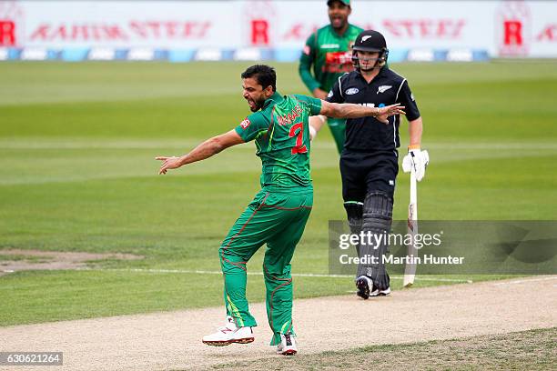 Mashrafe Mortaza of Bangladesh celebrates the wicket of Martin Guptill of New Zealand during the second One Day International match between New...