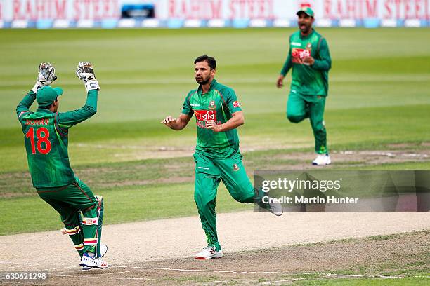 Mashrafe Mortaza of Bangladesh celebrates the wicket of Martin Guptill of New Zealand during the second One Day International match between New...