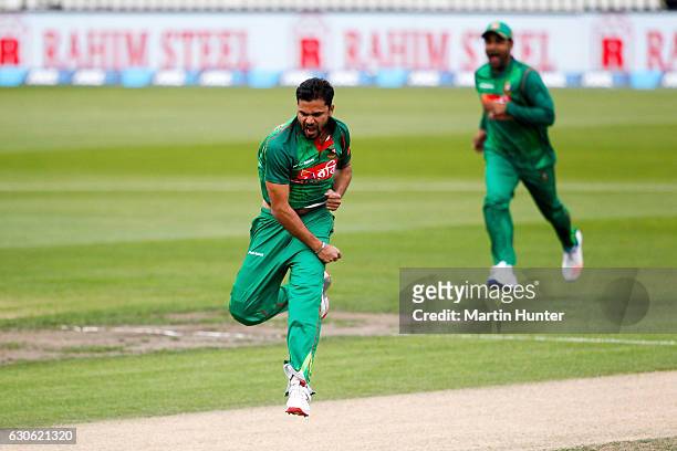Mashrafe Mortaza of Bangladesh celebrates the wicket of Martin Guptill of New Zealand during the second One Day International match between New...