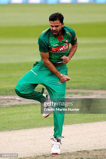 Mashrafe Mortaza of Bangladesh celebrates the wicket of Martin Guptill of New Zealand during the second One Day International match between New...