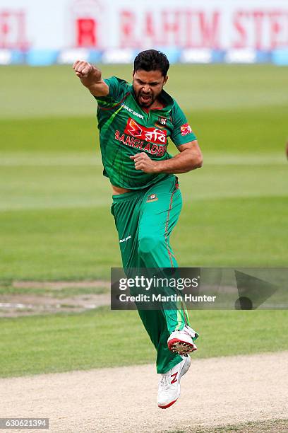 Mashrafe Mortaza of Bangladesh celebrates the wicket of Martin Guptill of New Zealand during the second One Day International match between New...