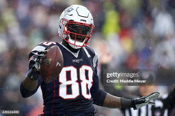 Martellus Bennett of the New England Patriots celebrates after scoring a touchdown against the New York Jets during the first half at Gillette...