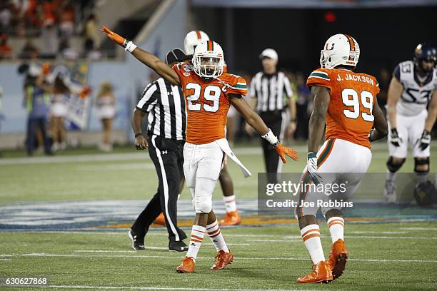 Corn Elder of the Miami Hurricanes celebrates after a fourth down stop against the West Virginia Mountaineers in the fourth quarter of the Russell...