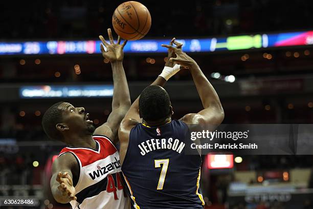 Andrew Nicholson of the Washington Wizards and Al Jefferson of the Indiana Pacers battle for the ball during the first half at Verizon Center on...