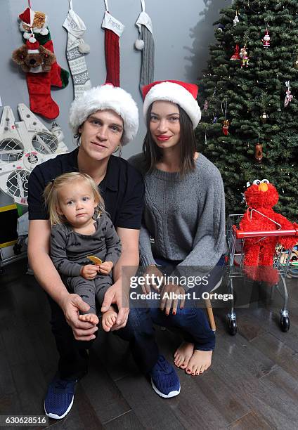 Actor Jason Mewes of Jay and Silent Bob poses with his daughter Logan and wife Jordan Monsanto in front of the Christmas Tree in Los Angeles on...