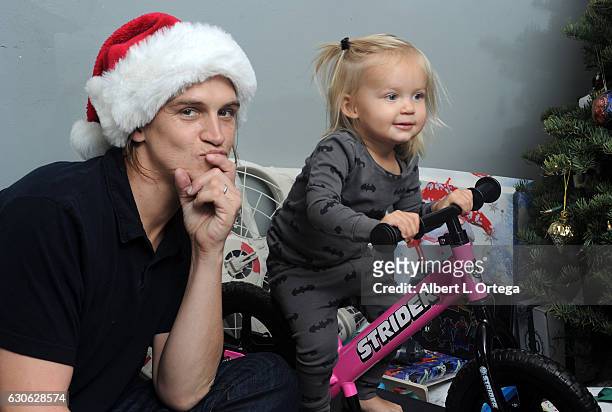 Actor Jason Mewes of Jay and Silent Bob poses with his daughter Logan and wife Jordan Monsanto in front of the Christmas Tree in Los Angeles on...
