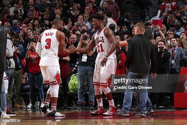 Dwyane Wade and Jimmy Butler of the Chicago Bulls celebrate after the game against the Brooklyn Nets on December 28, 2016 at the United Center in...