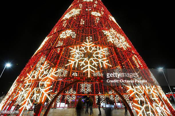 People take one picture into a Christmas tree of lights on December 29, 2016 in Funchal, Madeira, Portugal.