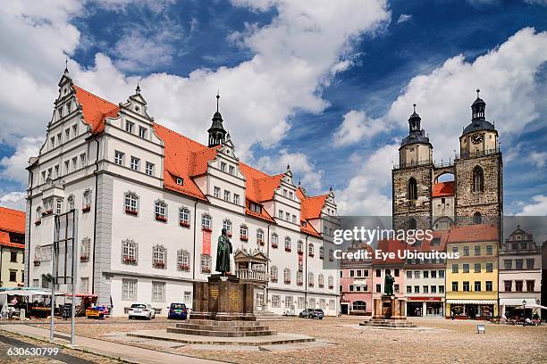 Germany, Saxony Anhalt, Lutherstadt Wittenberg, Marktplatz with the Rathaus and Pfarrkirche St Marien in the background, the Pfarrkirche St Marien is...