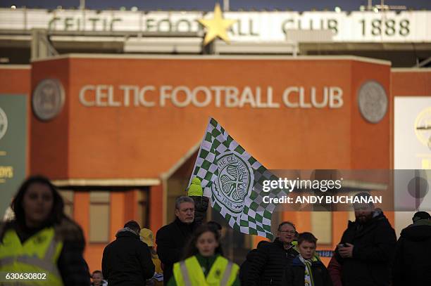 Celtic fans arrive at Celtic Park in Glasgow on December 17, 2016 before the Scottish Premiership football match between Celtic and Dundee United....