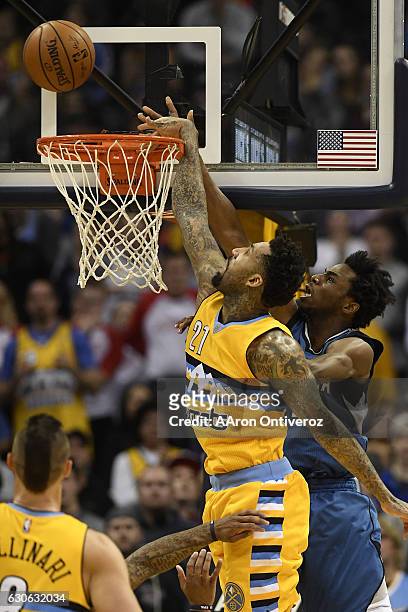 Wilson Chandler of the Denver Nuggets blocks a potential game-tying shot by Andrew Wiggins of the Minnesota Timberwolves with less than 10 seconds to...