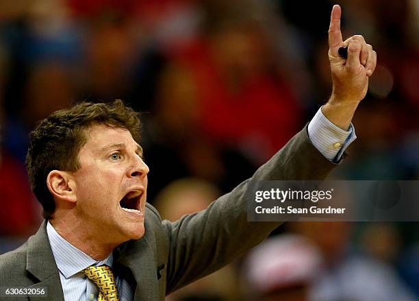 Associate head coach Darren Erman instructs his team during the second half of a game against the LA Clippers at the Smoothie King Center on December...