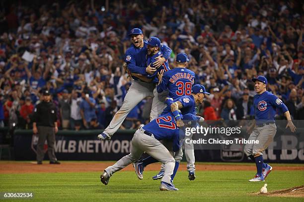 The Chicago Cubs celebrate after defeating the Cleveland Indians, Nov. 3, 2016 in Game 7 to win the World Series 8-7 at Progressive Field in...