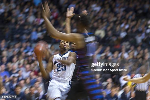 Villanova Wildcats guard Mikal Bridges charges towards the net in a blur during the game between the Villanova Wildcats and the DePaul Blue Demons on...