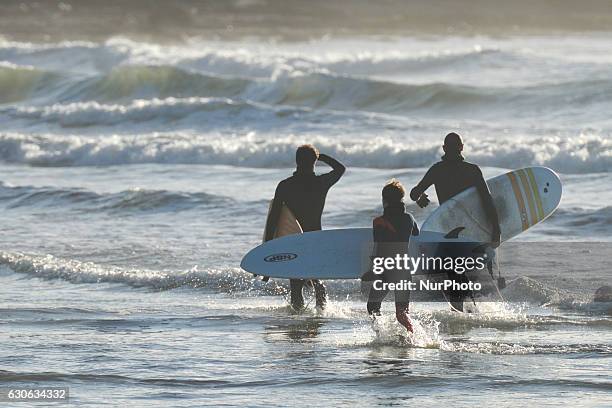 Surfers getting ready to catch some waves at Lahinch. On Wednesday, 28 December 2016, in Lahinch, County Clare, Ireland.