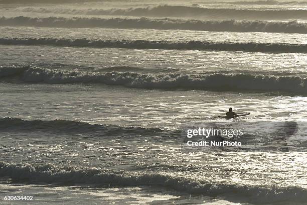 Surfer getting ready to catch some waves at Lahinch. On Wednesday, 28 December 2016, in Lahinch, County Clare, Ireland.