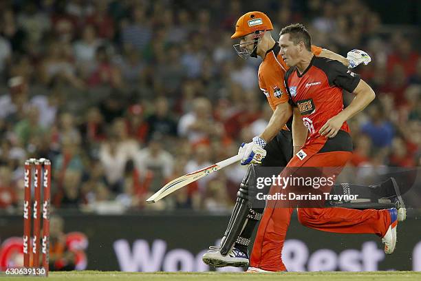 Shaun Marsh of the Perth Scorchers collides with Chris Tremain of the Melbourne Renegades while running a quick single during the Big Bash League...