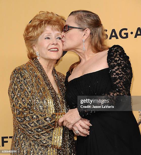 Debbie Reynolds and Carrie Fisher pose in the press room at the 21st annual Screen Actors Guild Awards at The Shrine Auditorium on January 25, 2015...