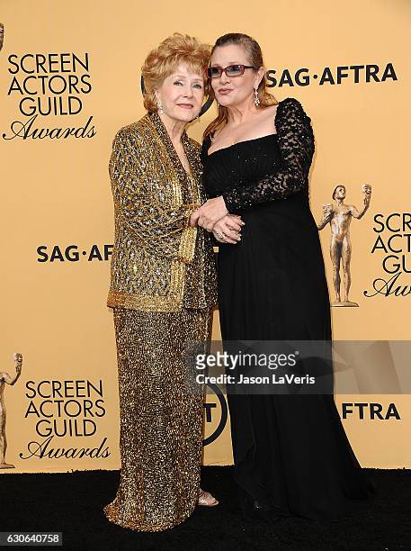 Debbie Reynolds and Carrie Fisher pose in the press room at the 21st annual Screen Actors Guild Awards at The Shrine Auditorium on January 25, 2015...