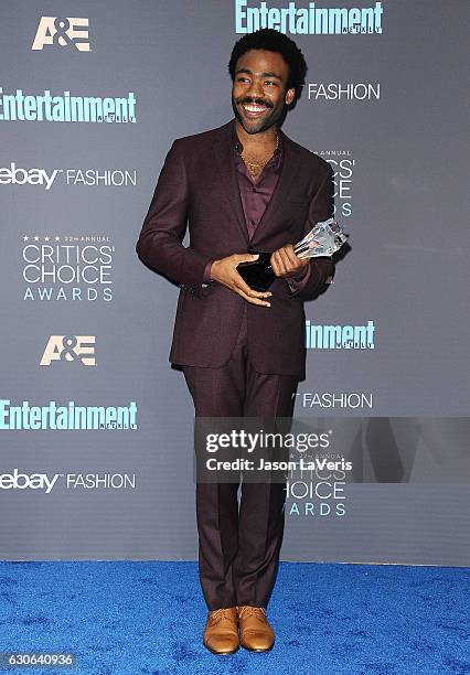 Actor Donald Glover poses in the press room at the 22nd annual Critics' Choice Awards at Barker Hangar on December 11, 2016 in Santa Monica,...