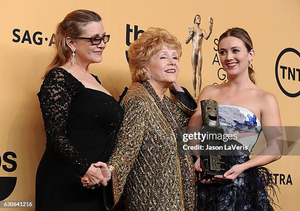 Carrie Fisher, Debbie Reynolds and Billie Catherine Lourd pose in the press room at the 21st annual Screen Actors Guild Awards at The Shrine...