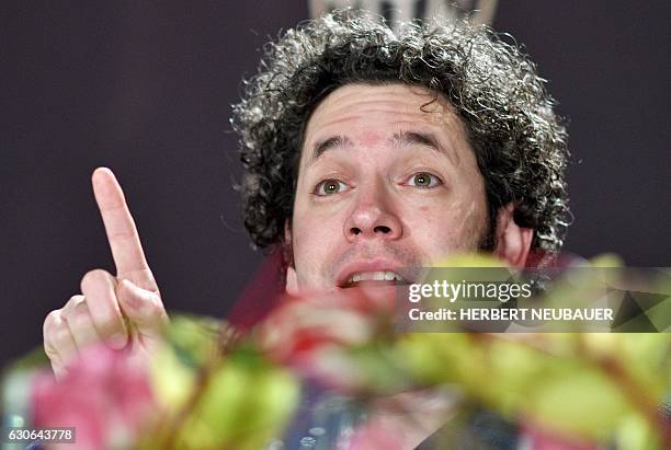 Venezulean conductor Gustavo Dudamel attends a press conference in Vienna, Austria, on December 29, 2016. Dudamel will conduct the traditional New...