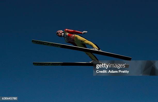 Severin Freund of Germany soars through the air during his training jump on Day 1 of the 65th Four Hills Tournament ski jumping event on December 29,...