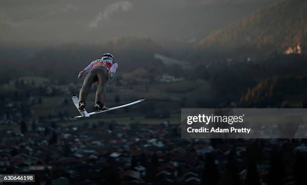 Jan Matura of Czech Republich soars through the air during his training jump on Day 1 of the 65th Four Hills Tournament ski jumping event on December...