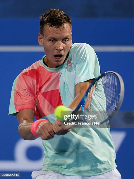 Tomas Berdych of the Czech Republic plays a backhand against Rafeal Nadal of Spain during day one of the Mubadala World Tennis Championship at Zayed...