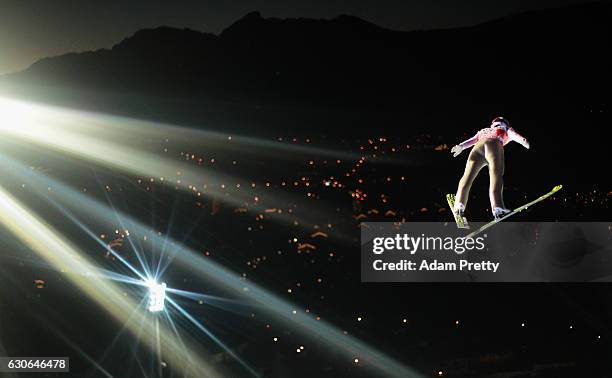 Lukas Hlava of Czech Republic soars through the air during his qualification jump on Day 1 of the 65th Four Hills Tournament ski jumping event on...