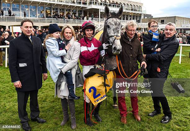 Dublin , Ireland - 29 December 2016; Jockey Bryan Cooper with winning connections including, from left, trainer Henry de Bromhead, Anita O'Leary,...