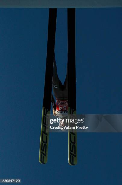 Daiki Ito of Japan soars through the air during his training jump on Day 1 of the 65th Four Hills Tournament ski jumping event on December 29, 2016...