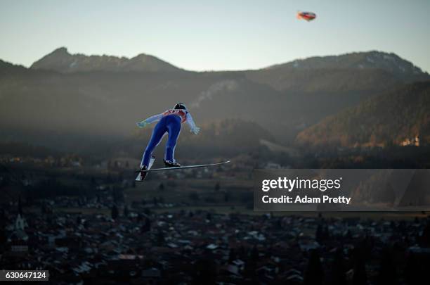 William Rhoads of USA soars through the air during his training jump on Day 1 of the 65th Four Hills Tournament ski jumping event on December 29,...