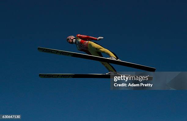 Severin Freund of Germany soars through the air during his training jump on Day 1 of the 65th Four Hills Tournament ski jumping event on December 29,...