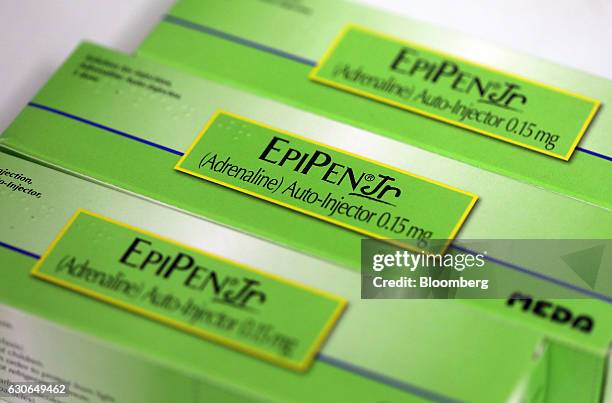 Boxes containing Epipen Junior epinephrine auto-injectors, produced by Meda AB, sit on a pharmacy counter in this arranged photograph in London,...